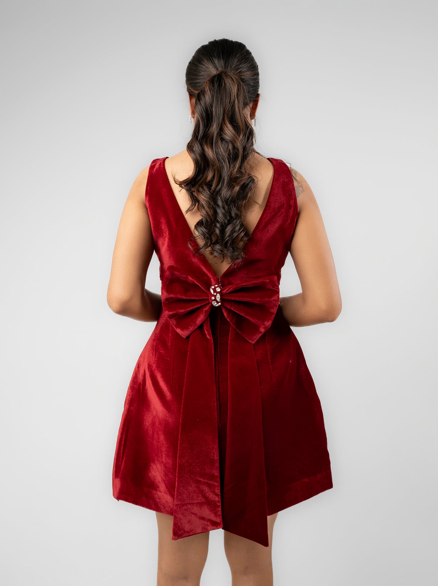 Frosty - velvet mini dress with stone detailing and detachable bow at the back