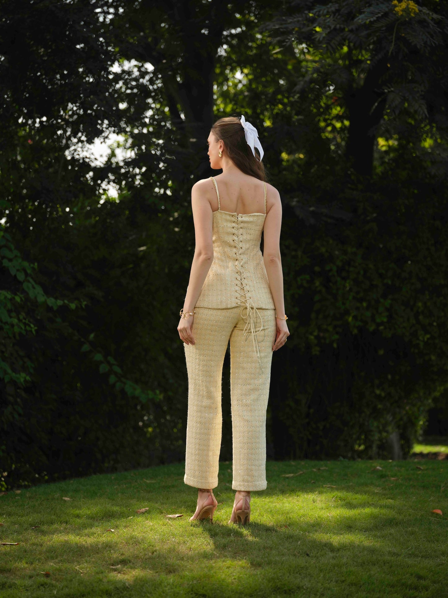 MARBELLA- Corset top with metal detailing paired with straight pants