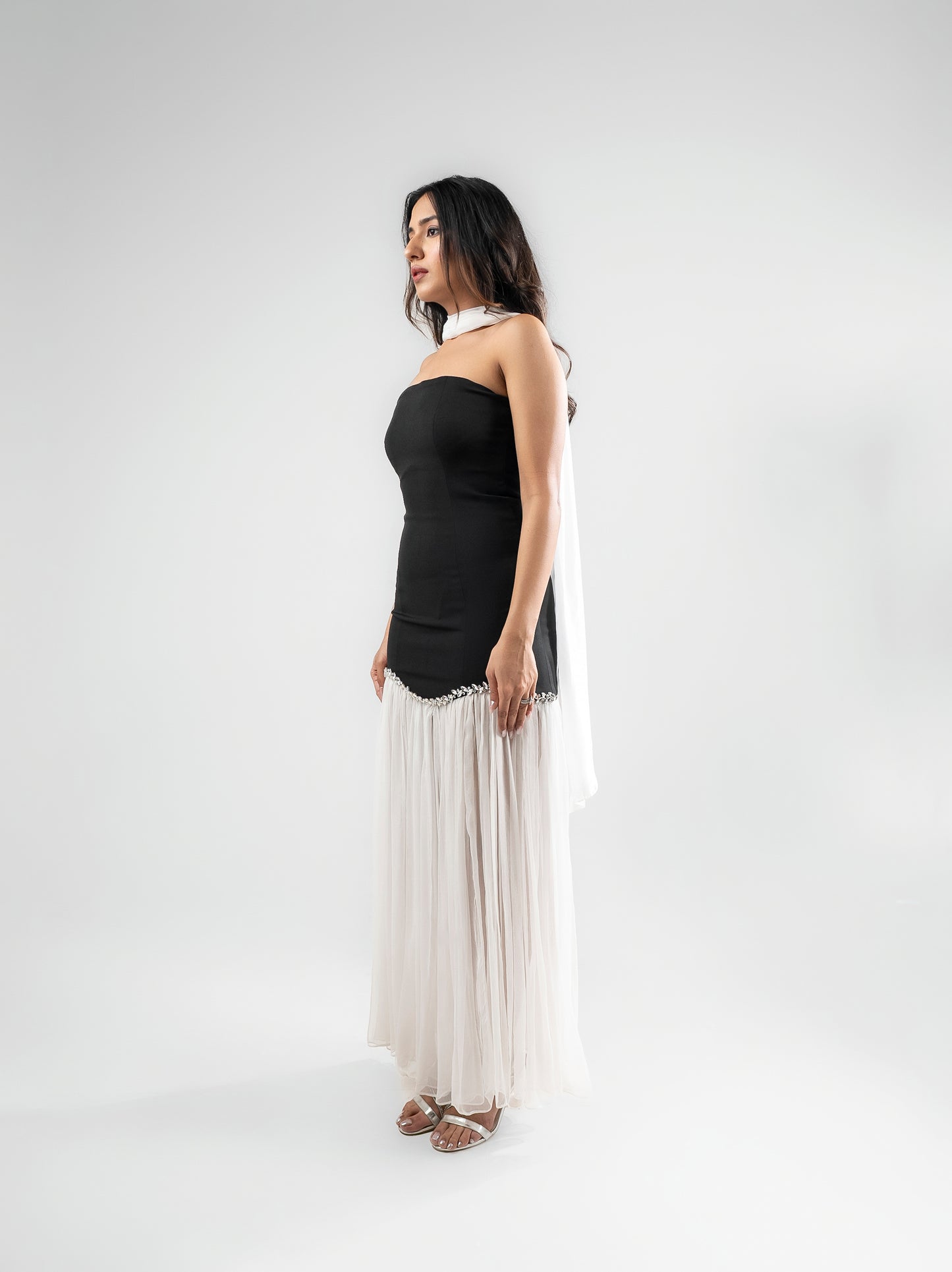 Parisienne - A long dress with intricate stone detailing, a sheer flared bottom, and a matching stole