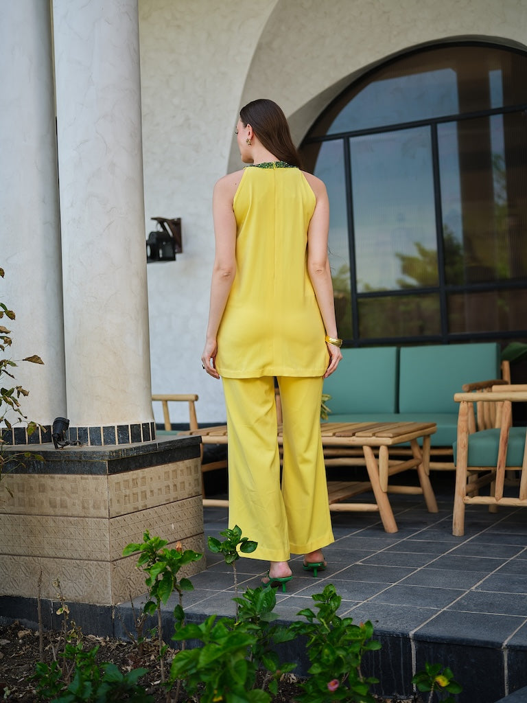 CITRUS-A bright yellow embroidered outfit with a beaded neckline and floral detailing.