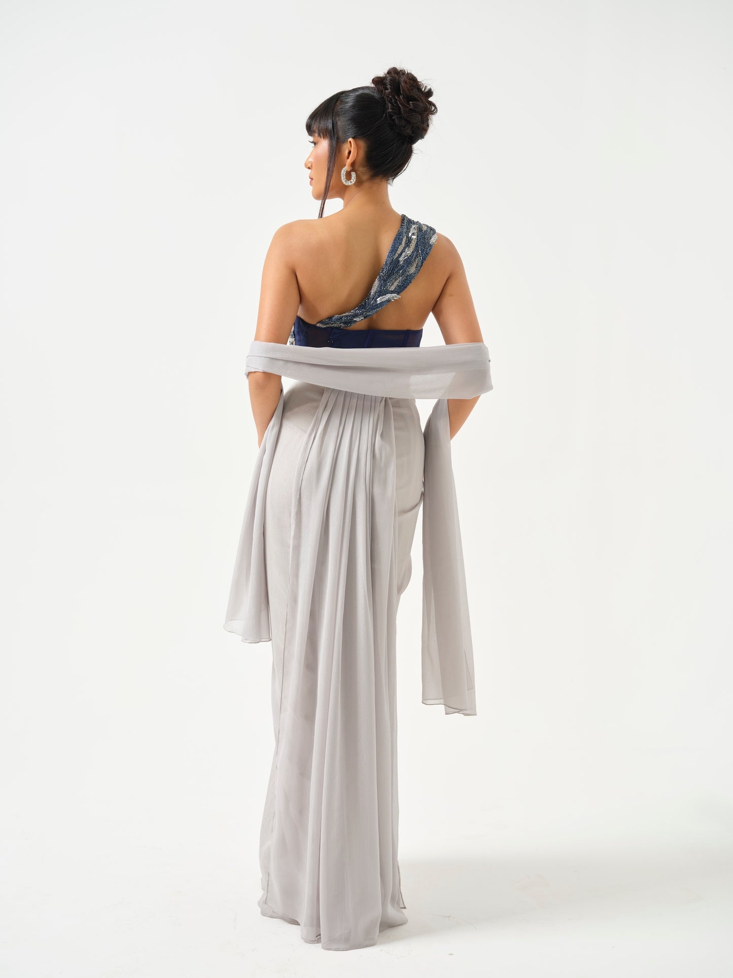 ZAHEEN- A heavily embroidered off shoulder top paired with drape skirt