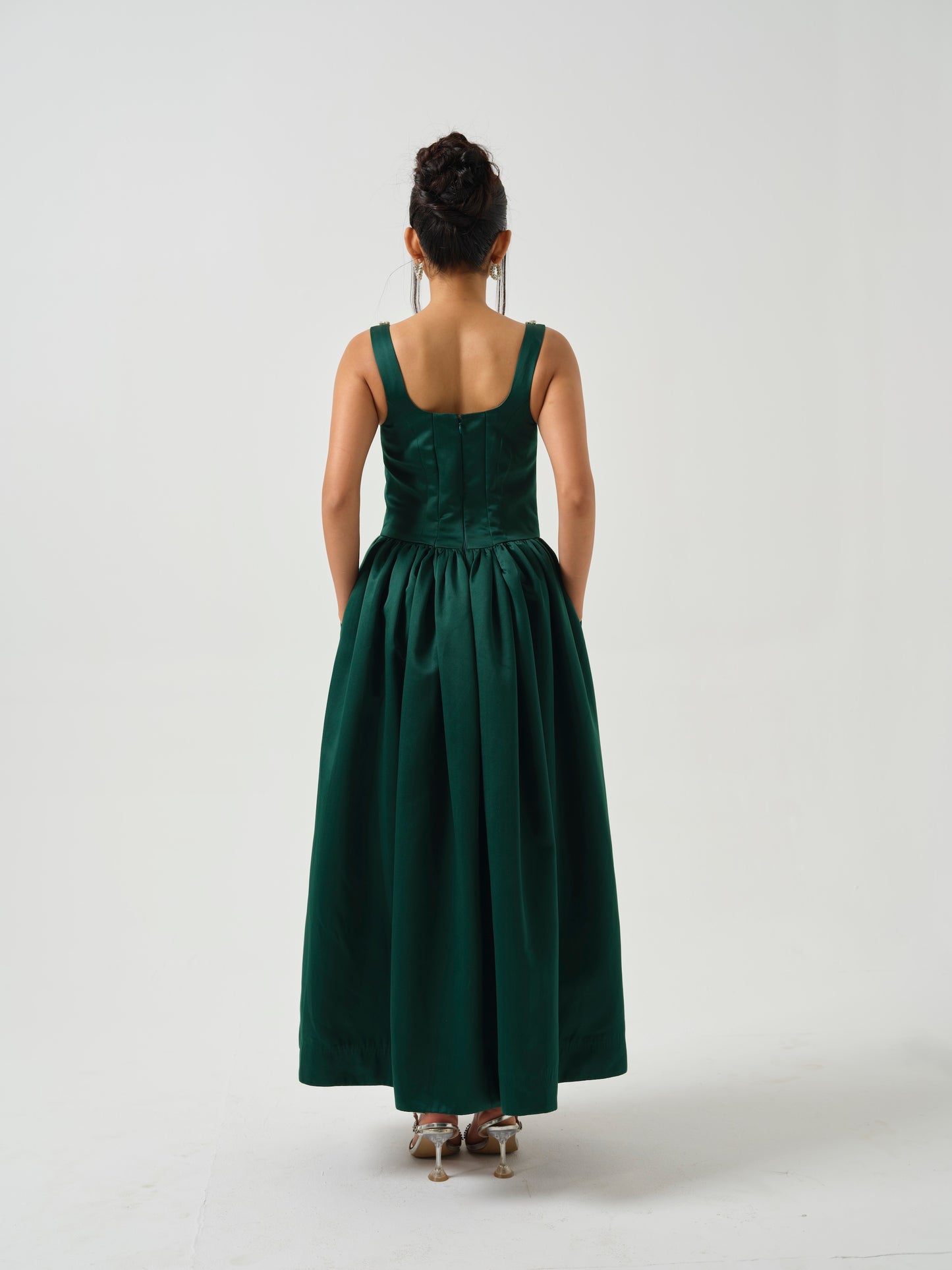 ELOWE -A T-length dress with stone detailing on neck.