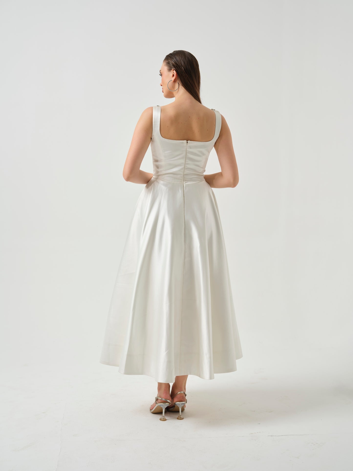 LILY- white T-length dress with stone detailing .