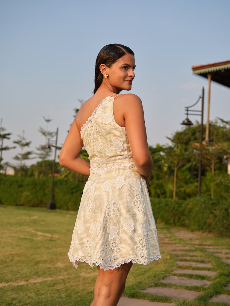 VIORA - A butter yellow off-shoulder cutwork dress with flare and lace detailing.