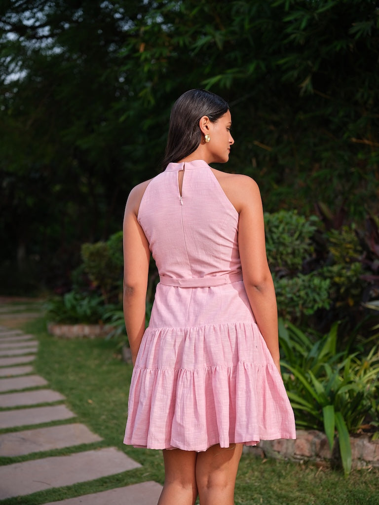 ESTELLE - A pink deep-cut dress with a two-tier gathered flare