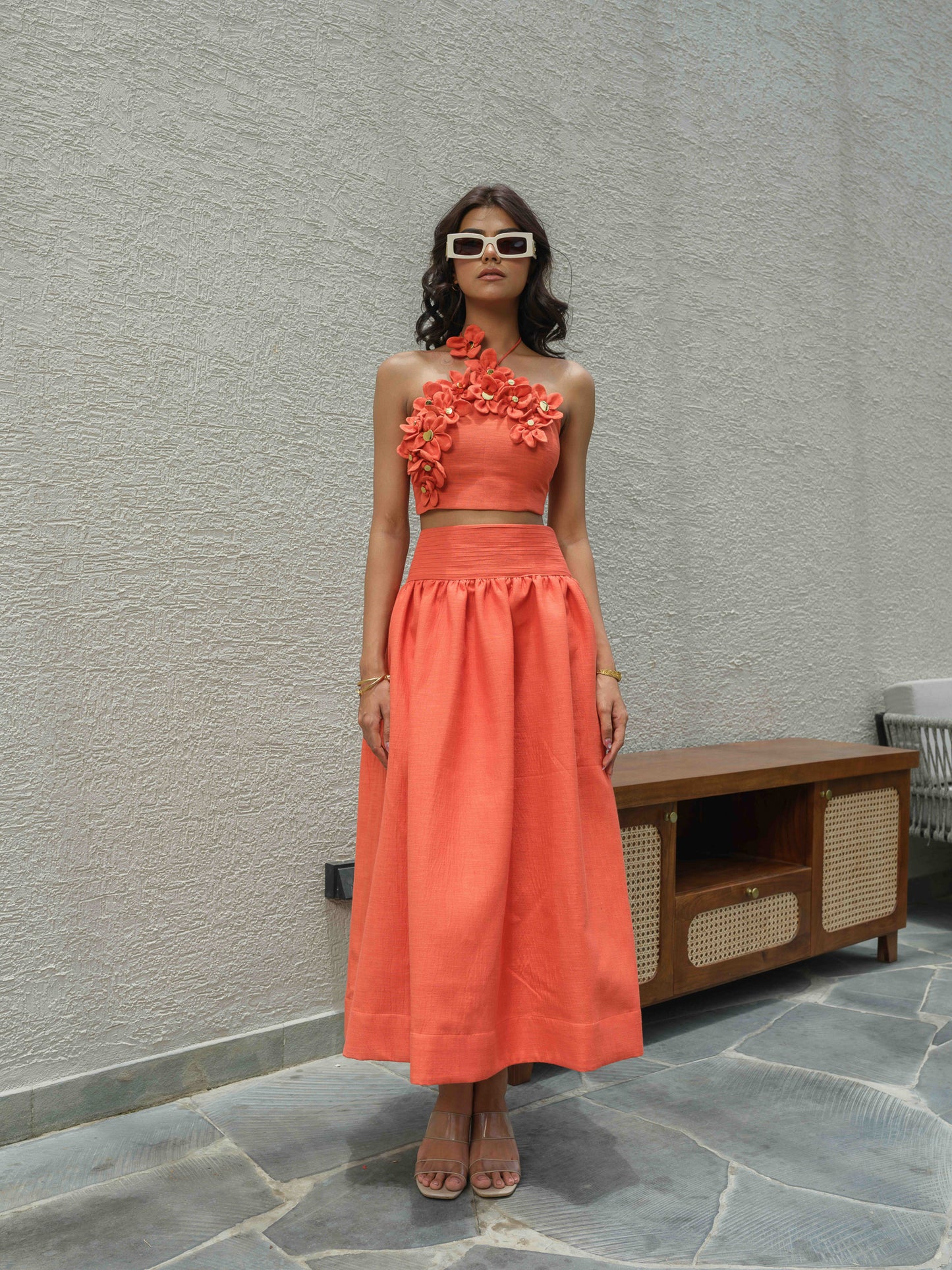 ELENA – Halter neck top paired with a skirt detailed at the waist
