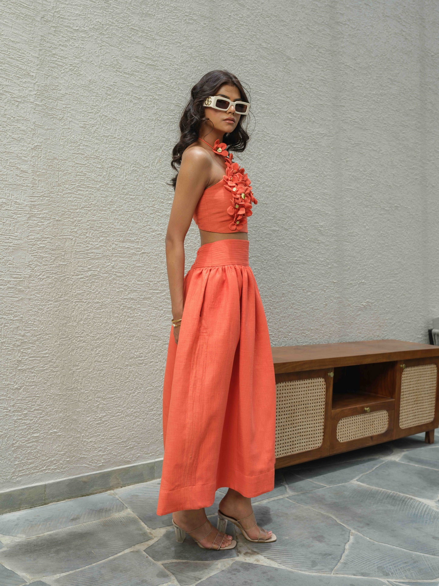 ELENA – Halter neck top paired with a skirt detailed at the waist