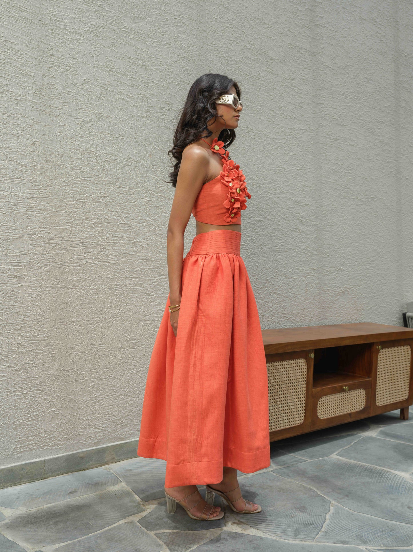 ELENA – Halter neck top paired with a skirt detailed at the waist