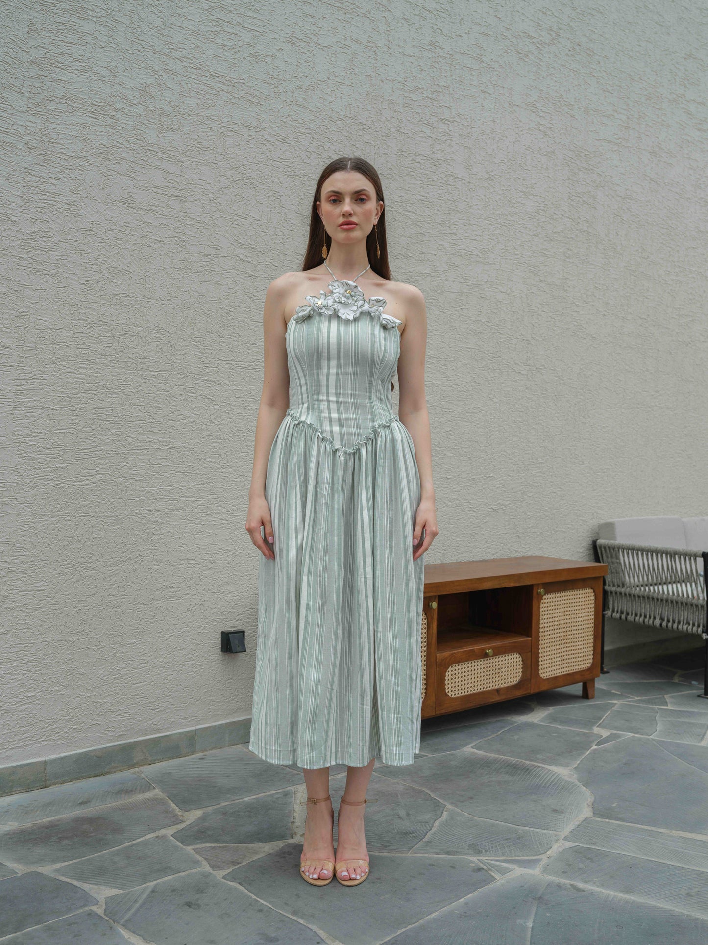 DAISY – A halterneck corset dress featuring fabric flower detailing on the top