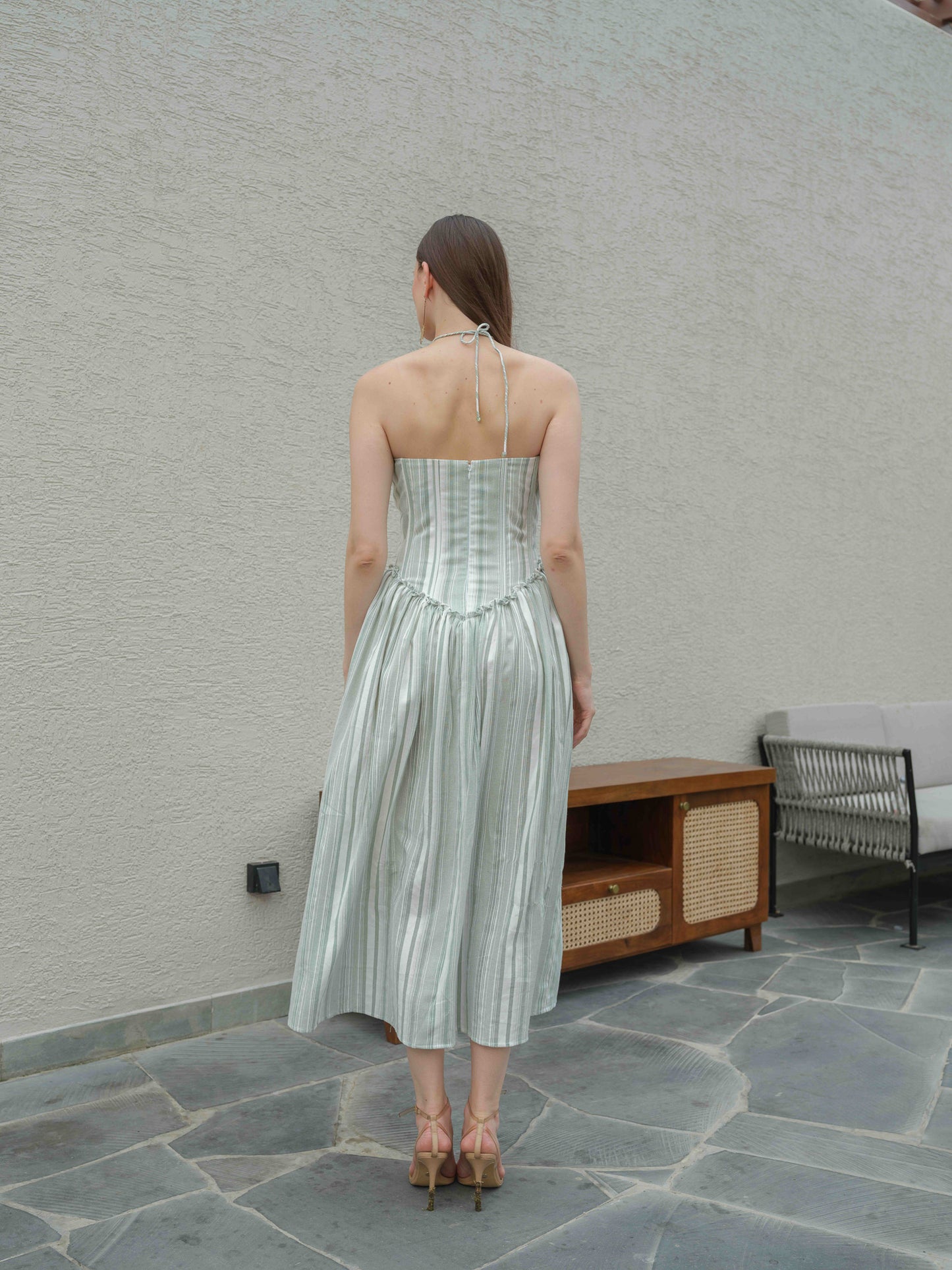 DAISY – A halterneck corset dress featuring fabric flower detailing on the top