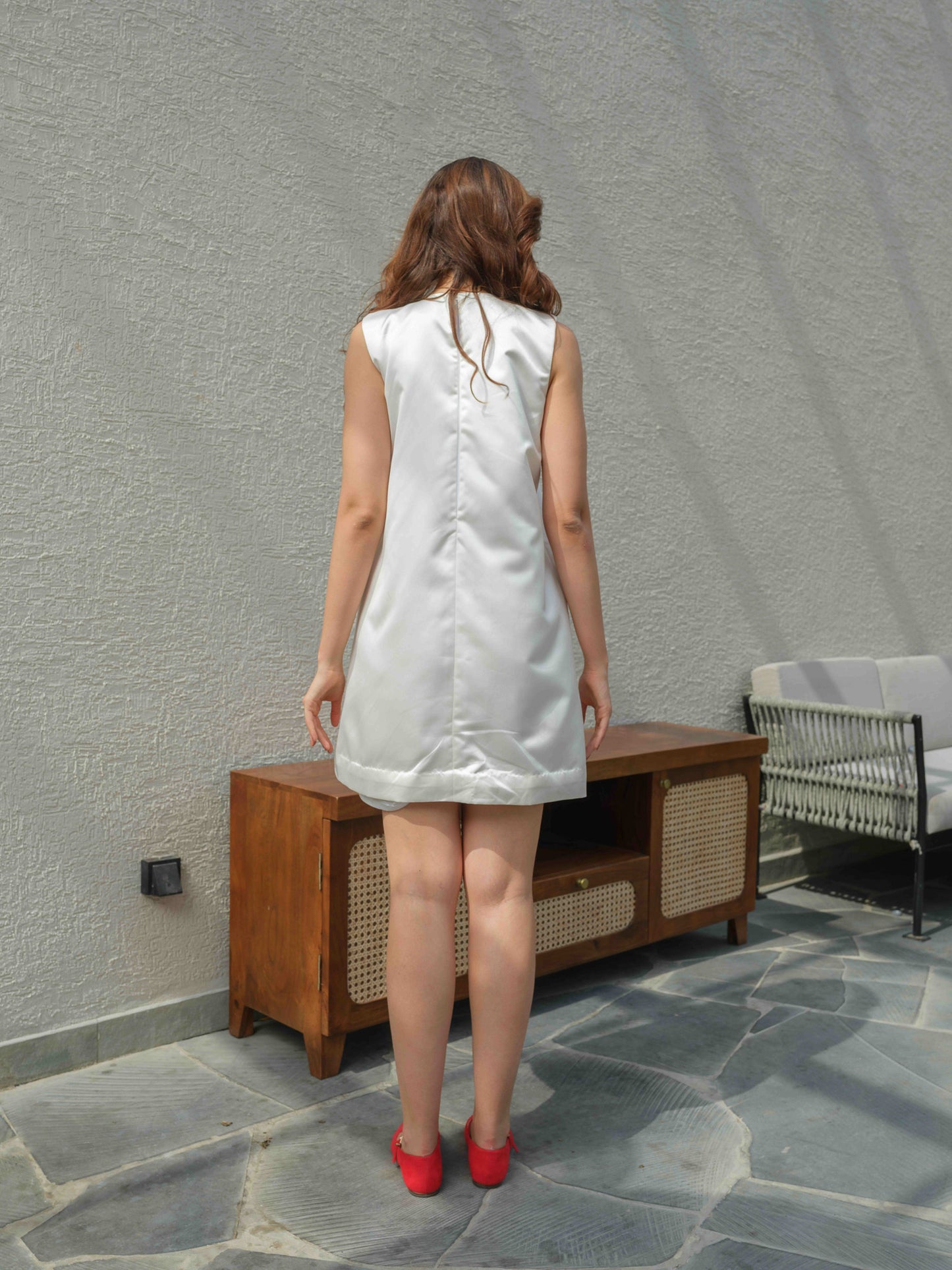 FLEURA – A short boxy dress featuring delicate floral embroidery