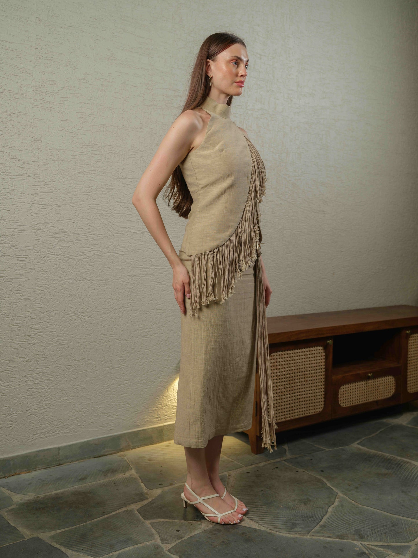 SWING – A co-ord set with a turtleneck top featuring fringe detailing, paired with a pencil-fit skirt