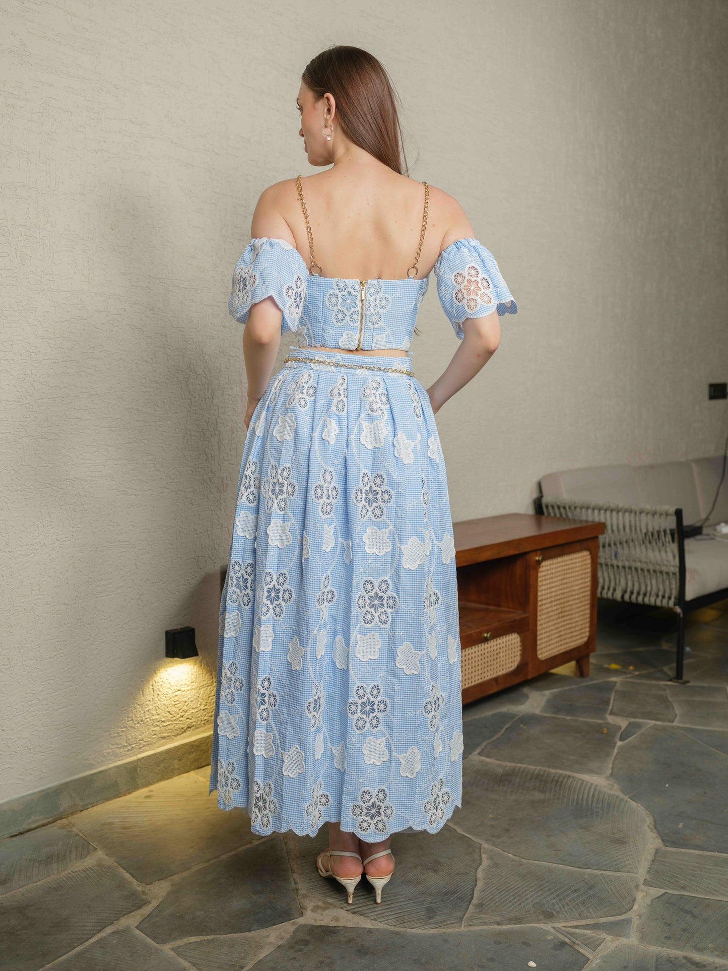 FLORESSA –corset with chain detailing, paired with a pleated skirt and detachable sleeves