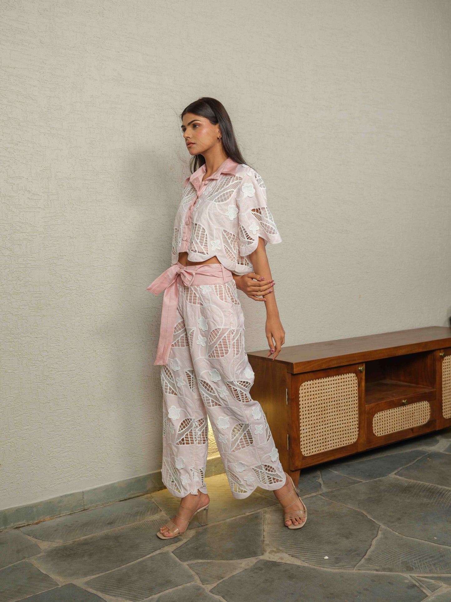 CELOURA – A trendy co-ord set featuring a crop shirt paired with flare pants.