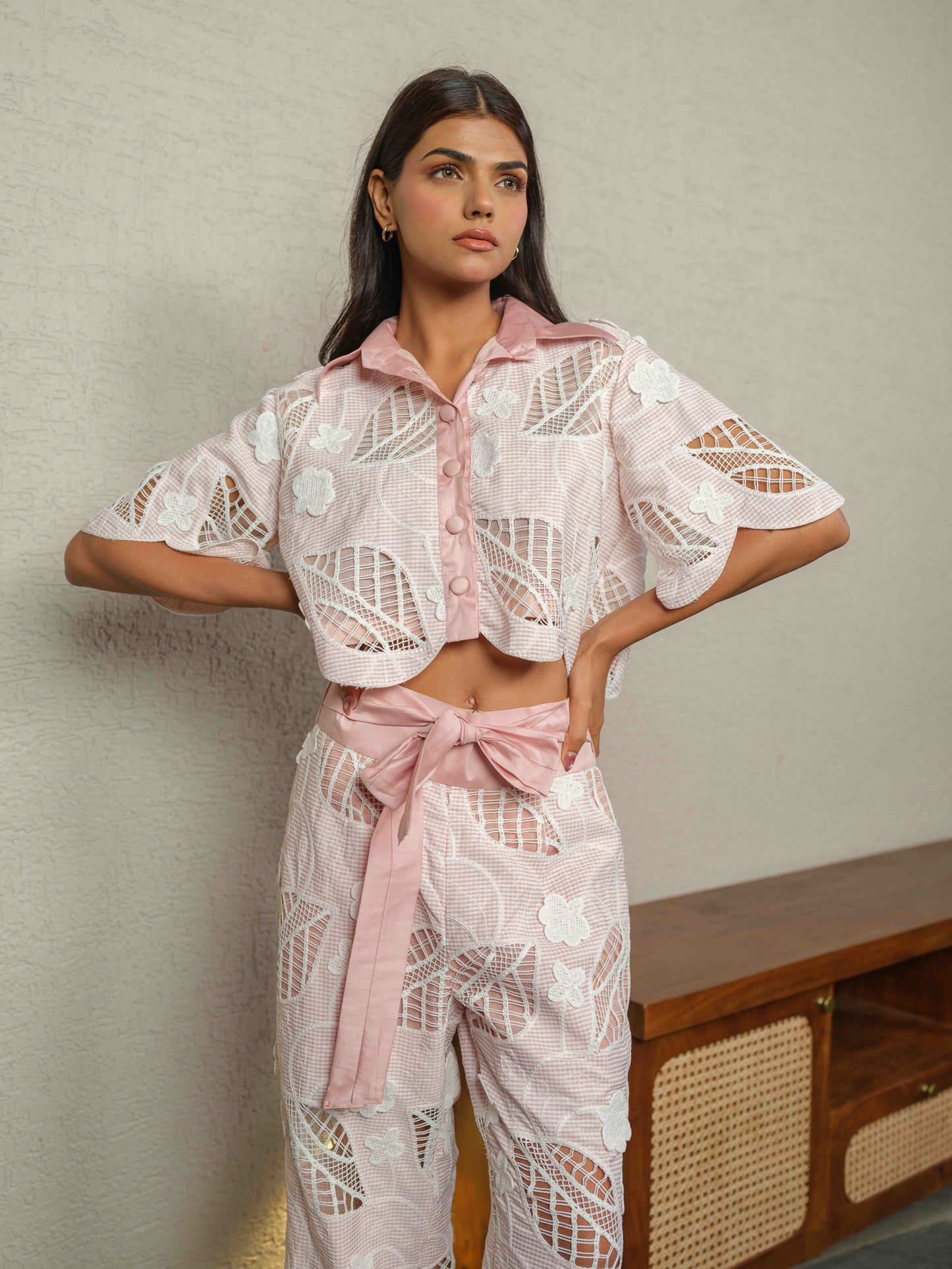 CELOURA – A trendy co-ord set featuring a crop shirt paired with flare pants.