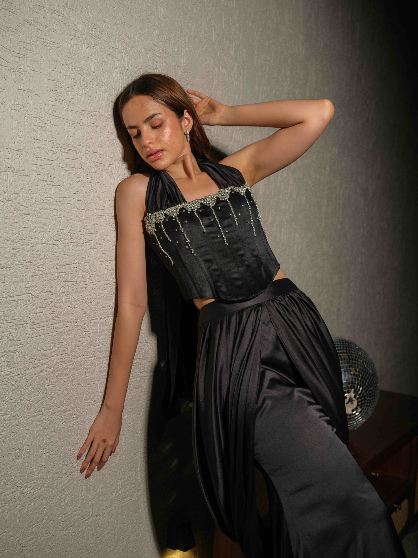 STARRY – A corset necktie top with stone detailing, paired with a pre-draped skirt