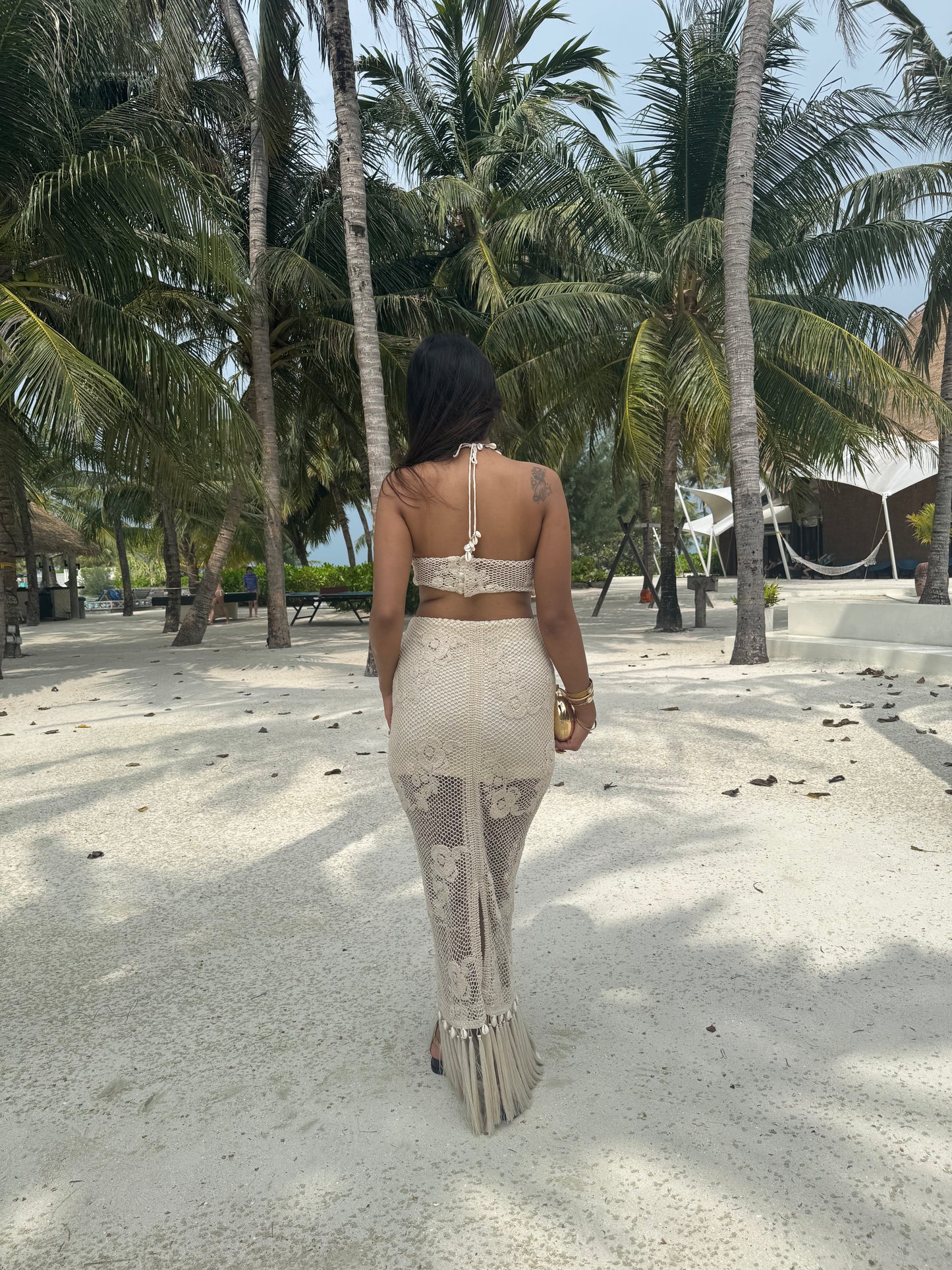 COVE– Crochet co-ord with a Kodi-detailed tube top paired with a pencil-fit skirt