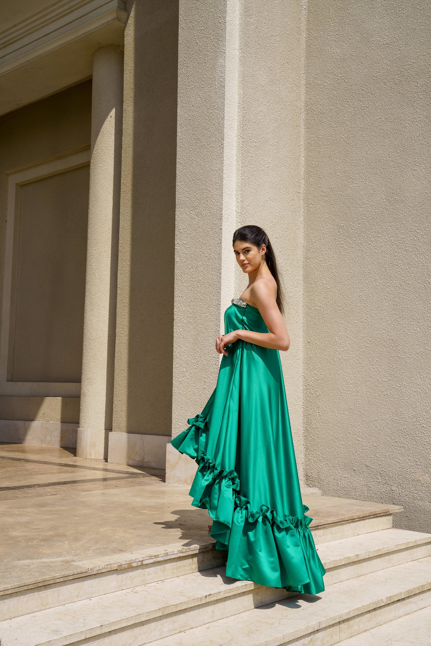 Deviya in Raquel Stone embellished high low satin dress
