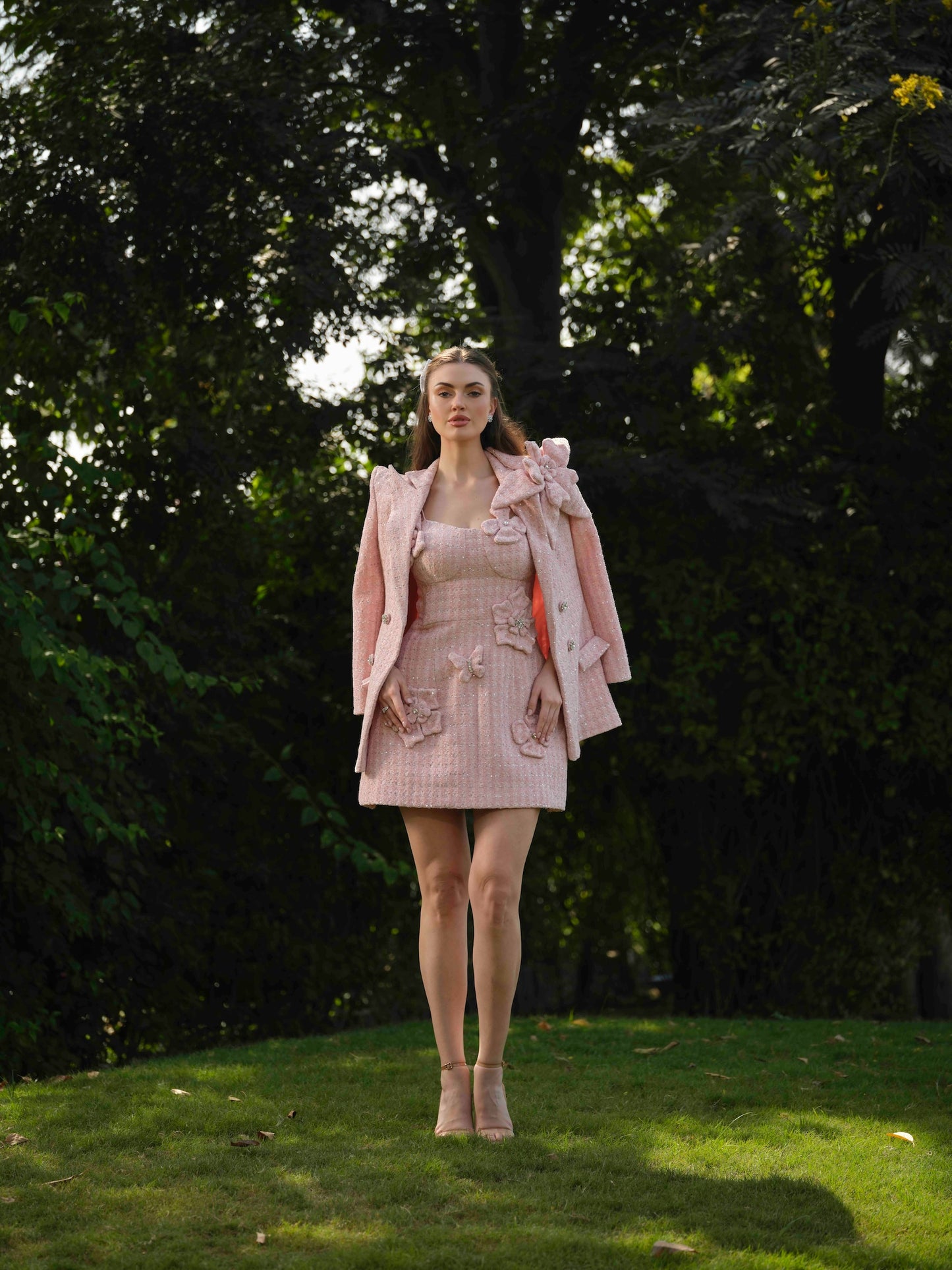 ELYSIA – A short dress with elegant flower detailing, paired with a stylish blazer.
