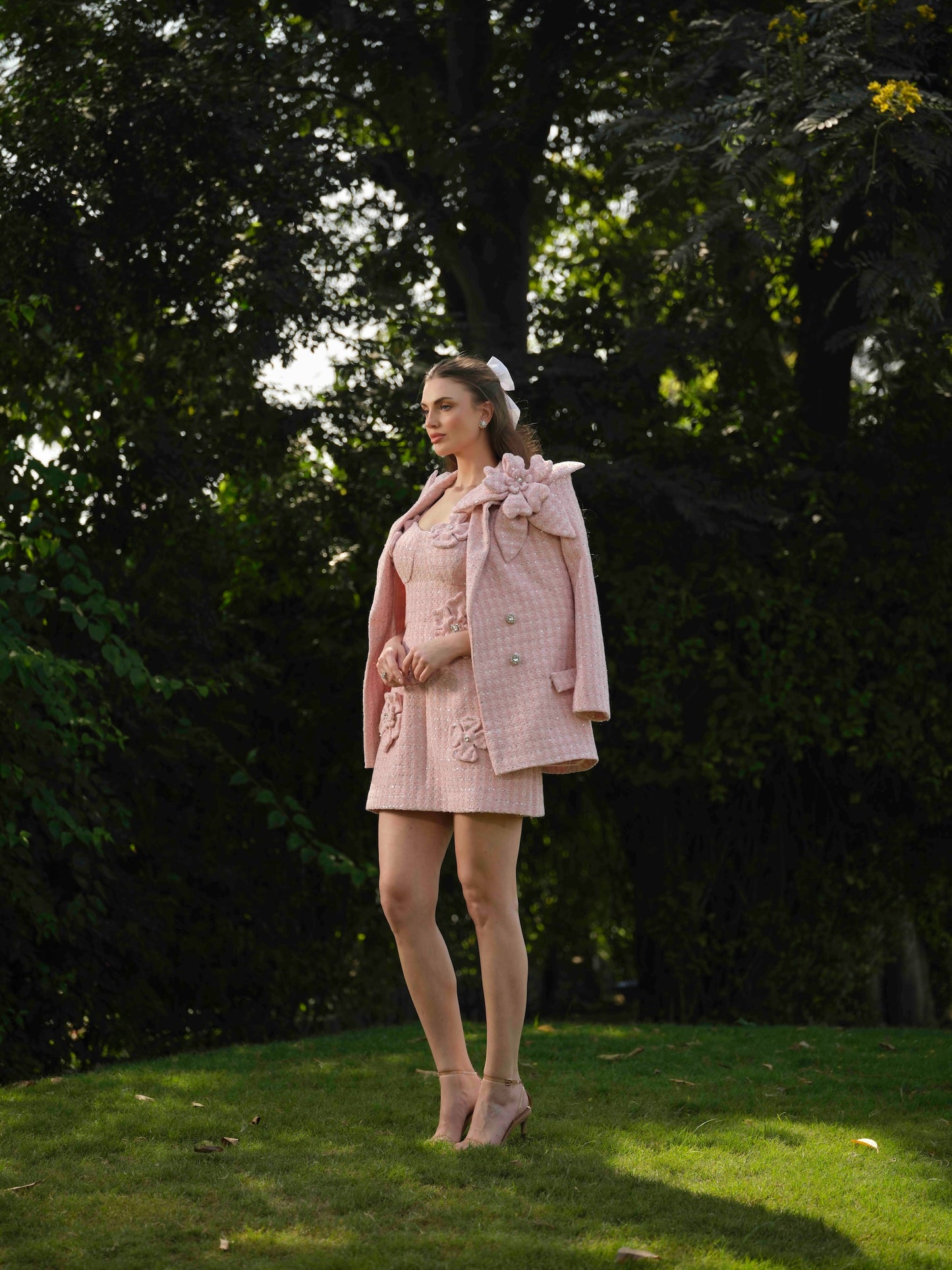 ELYSIA – A short dress with elegant flower detailing, paired with a stylish blazer.