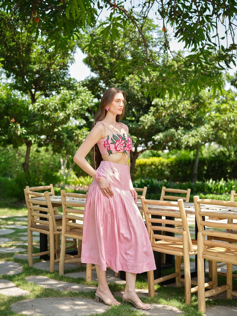 ROSELLE - A pink appliqué tie-up top paired with a fine pleated skirt.