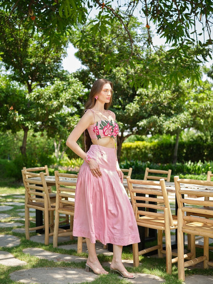 ROSELLE - A pink appliqué tie-up top paired with a fine pleated skirt.