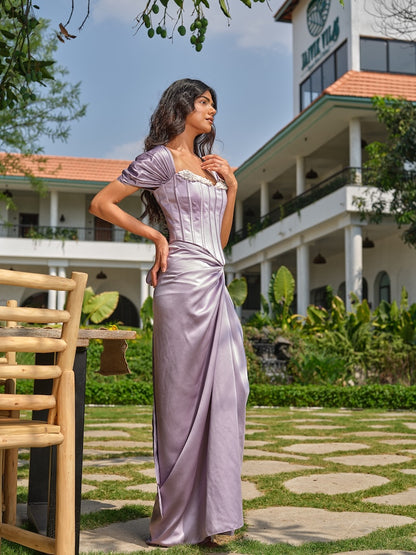 LAVENDER ATELIER - A lilac corset with stone and pearl neckline detailing paired with a draped skirt.