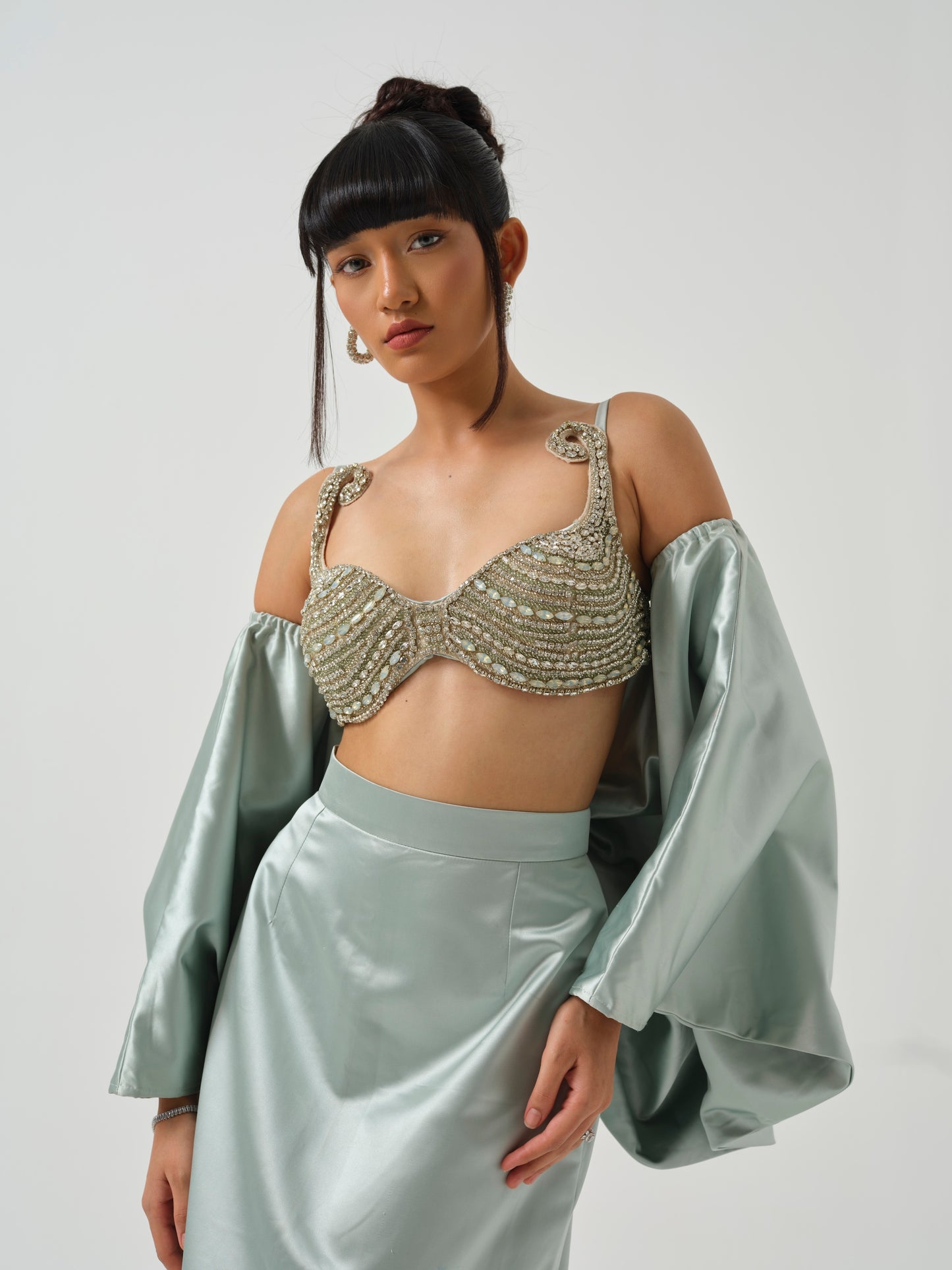 INAAYA- A heavily embroidered blouse paired with skirt and bow
