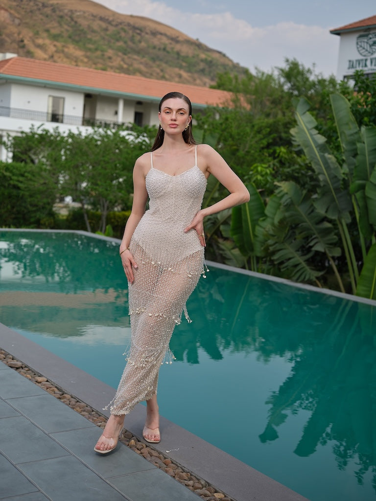 LAVIERA- A ivory crochet corset dress with latkan detailing.