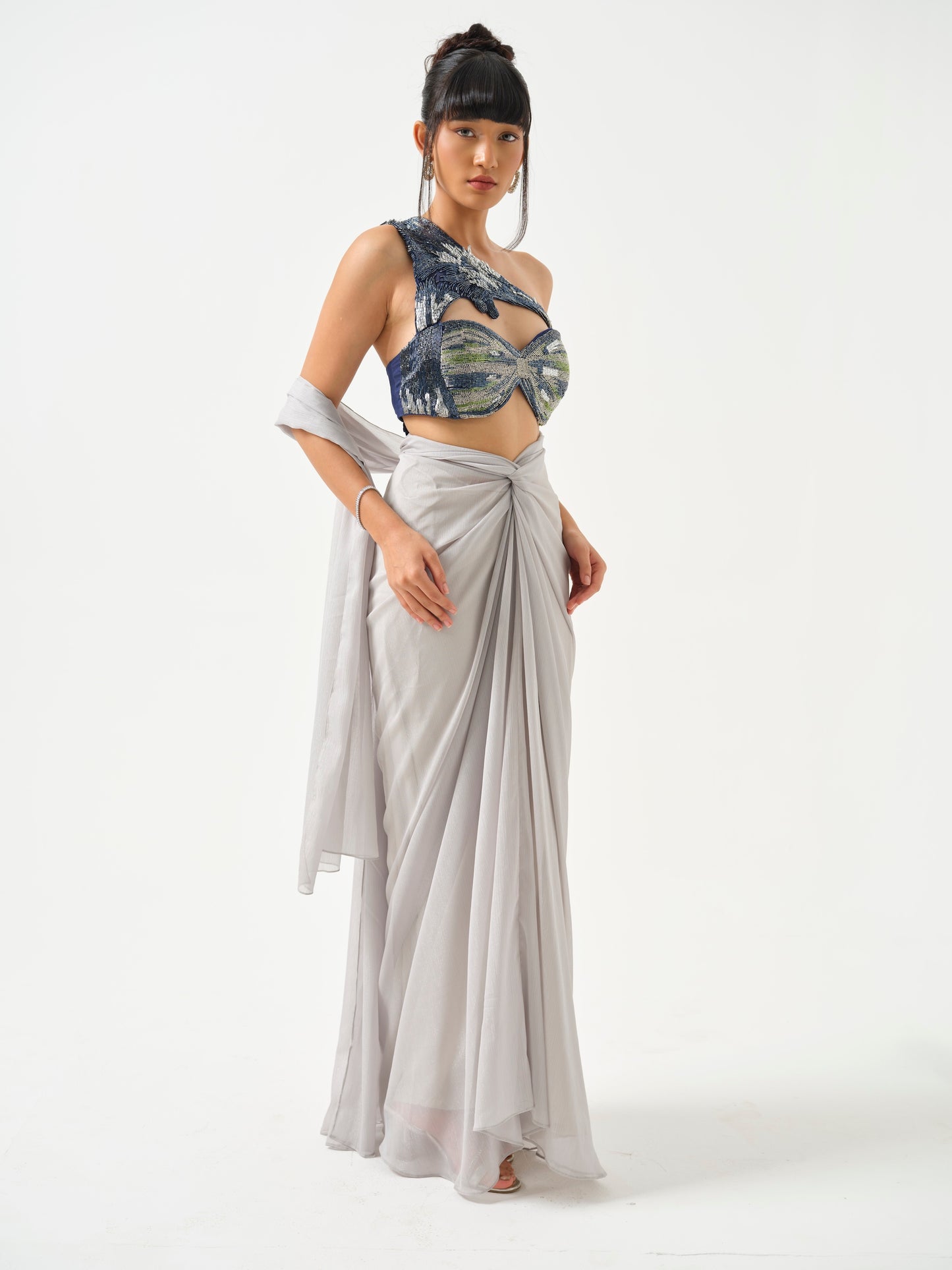 ZAHEEN- A heavily embroidered off shoulder top paired with drape skirt