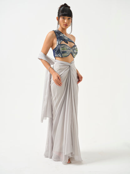 ZAHEEN- A heavily embroidered off shoulder top paired with drape skirt