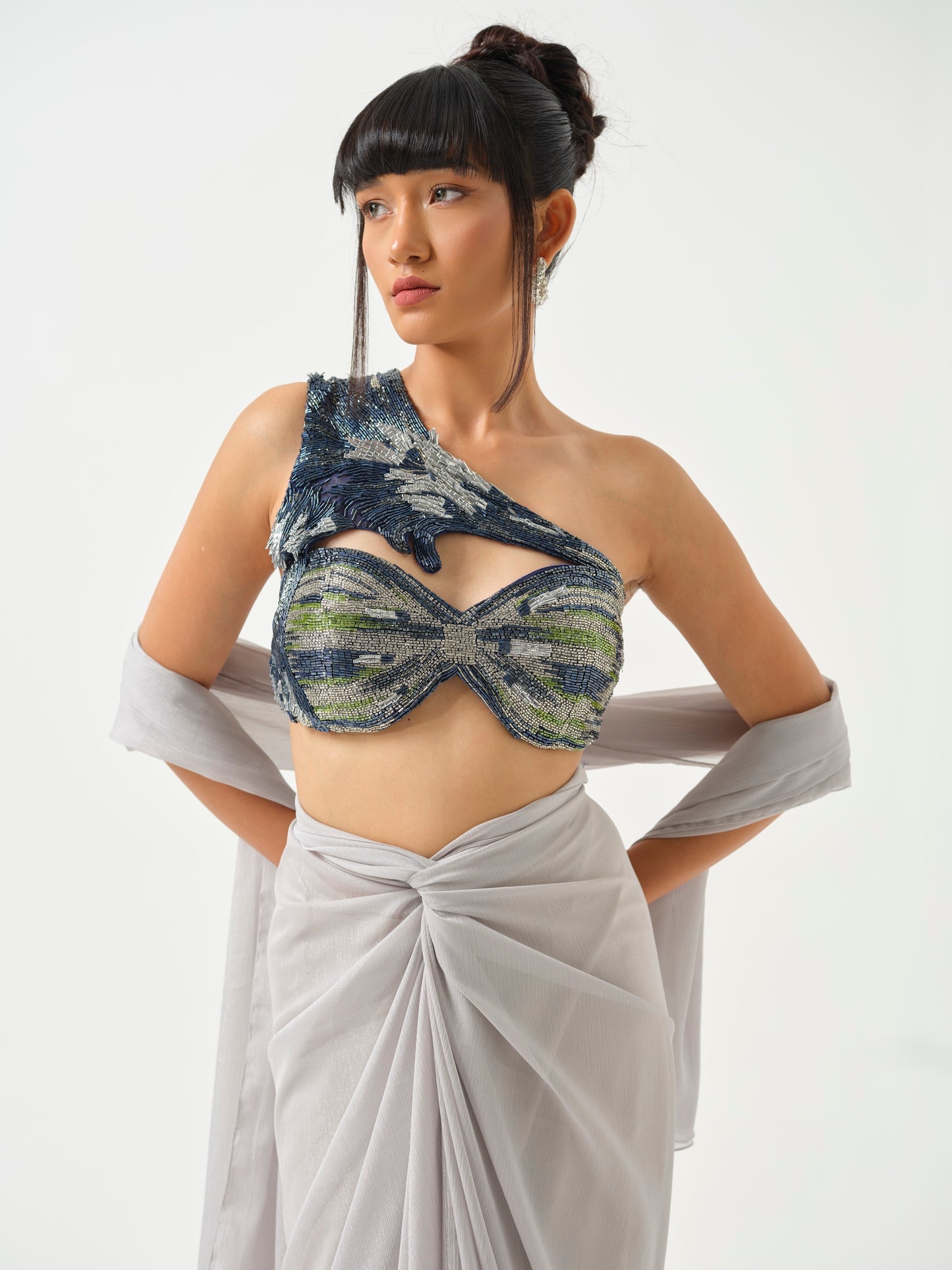 ZAHEEN- A heavily embroidered off shoulder top paired with drape skirt