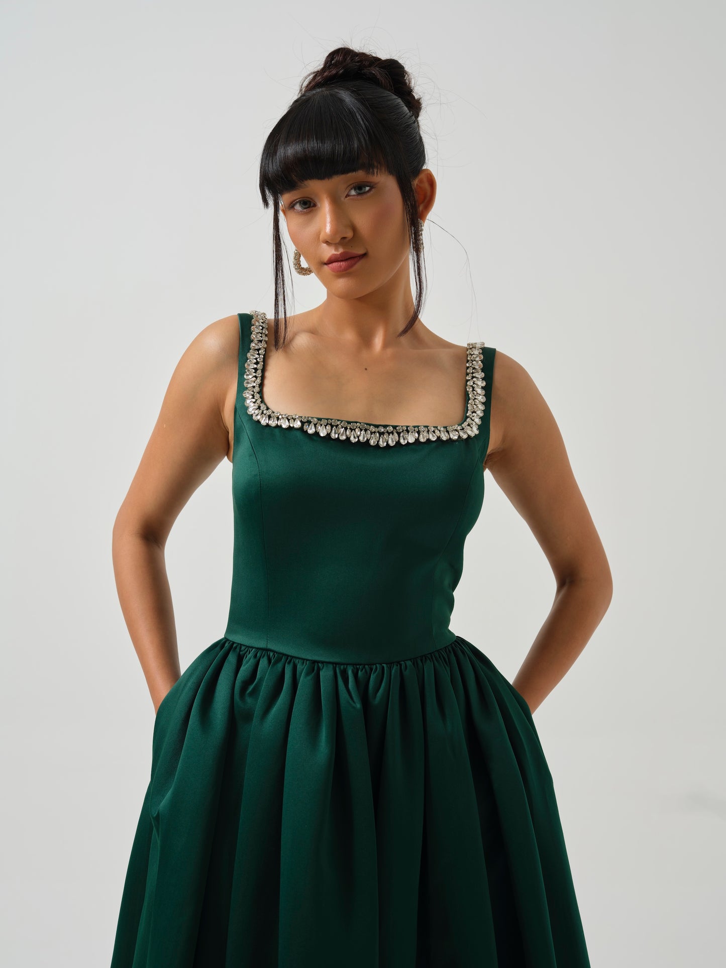 ELOWE -A T-length dress with stone detailing on neck.