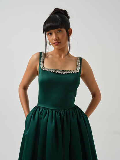 ELOWE -A T-length dress with stone detailing on neck.