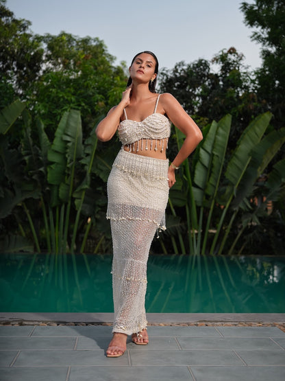 ELAROSE - An ivory embellished co-ord with a tasseled bralette and sheer fitted skirt.