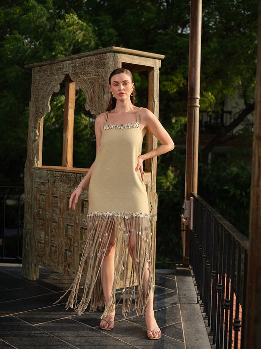AVELORA - A chic beige mini dress with shell detailing and statement dori at the hem
