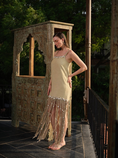 AVELORA - A chic beige mini dress with shell detailing and statement dori at the hem