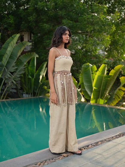 AVELINE - A buff top with  dori, and kodi shell detailing paired with flared pants.