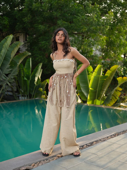 AVELINE - A buff top with  dori, and kodi shell detailing paired with flared pants.