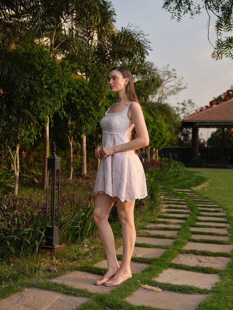 LIORA -A pink cutwork dress with a square neck and back cut-out.