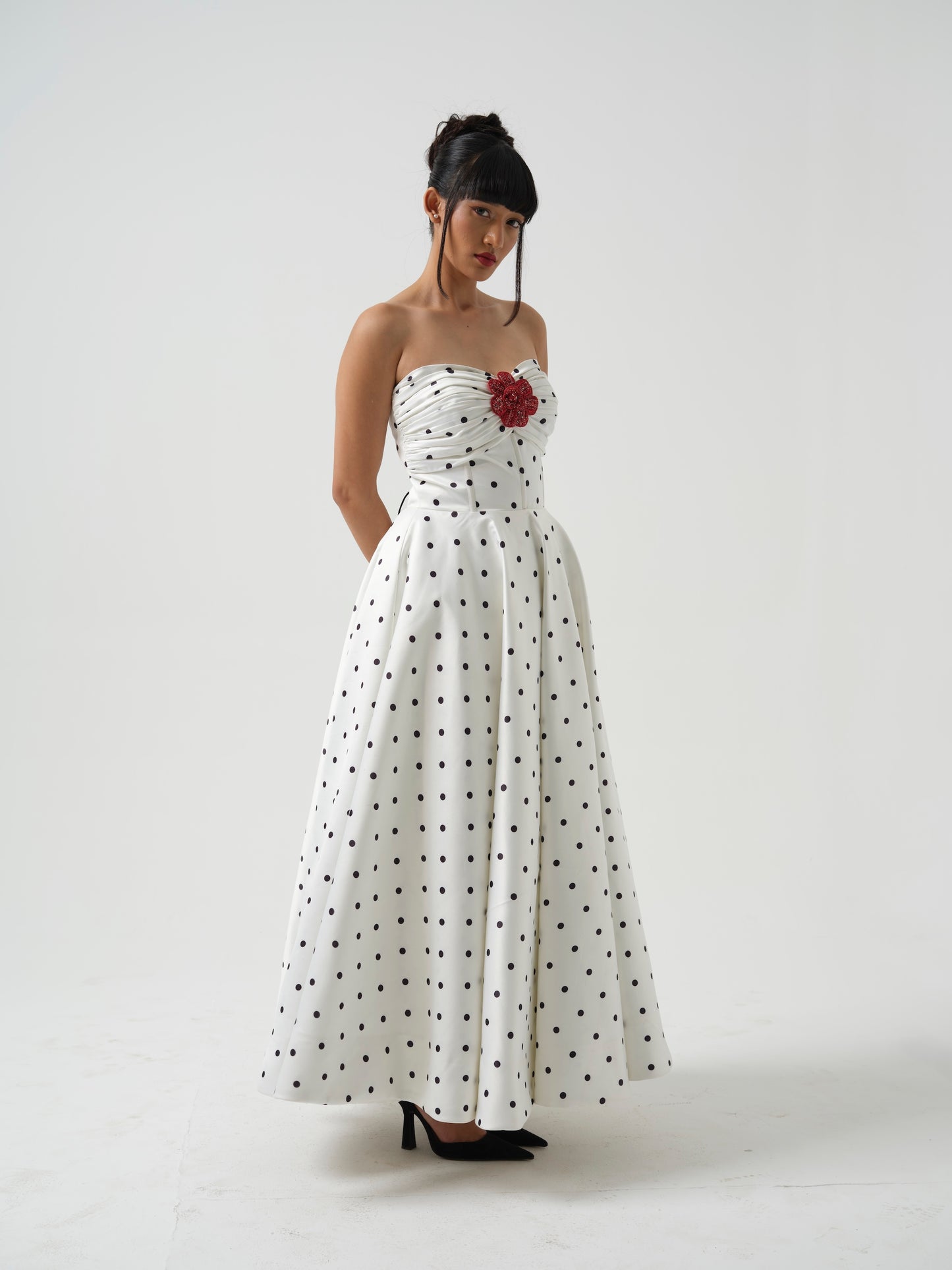 FLOSSY-A long corset dress with flower detailing.