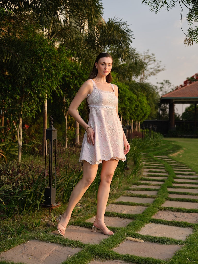 LIORA -A pink cutwork dress with a square neck and back cut-out.