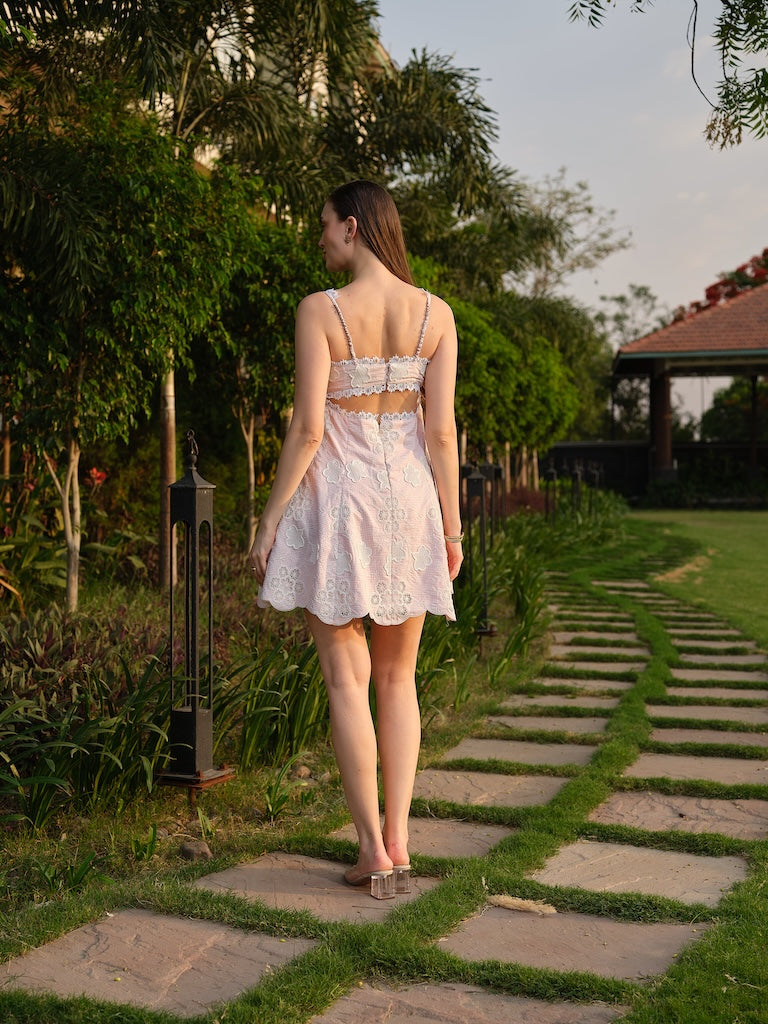 LIORA -A pink cutwork dress with a square neck and back cut-out.