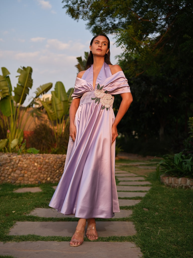 ROSALIE - A lilac tea-length dress with elegant pleating at the waist and a halterneck with a soft flap detail.
