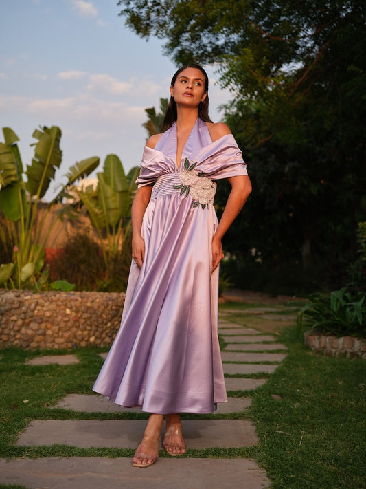 ROSALIE - A lilac tea-length dress with elegant pleating at the waist and a halterneck with a soft flap detail.