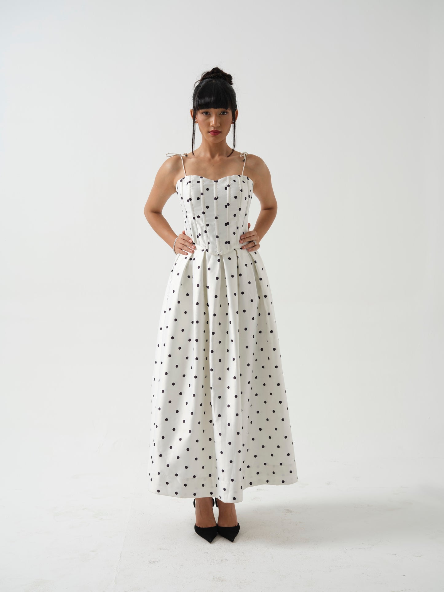 BLOOMIE- corset top paired it with tea length skirt.