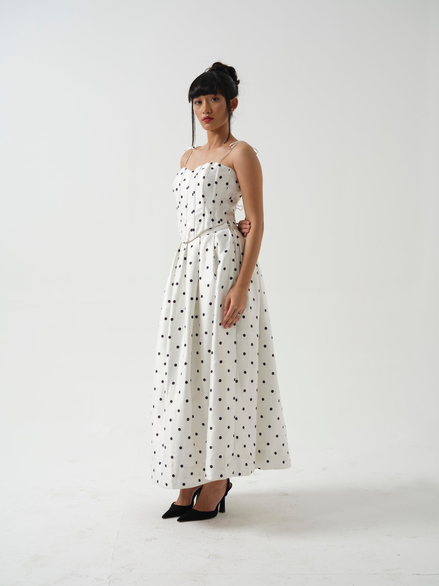 BLOOMIE- corset top paired it with tea length skirt.