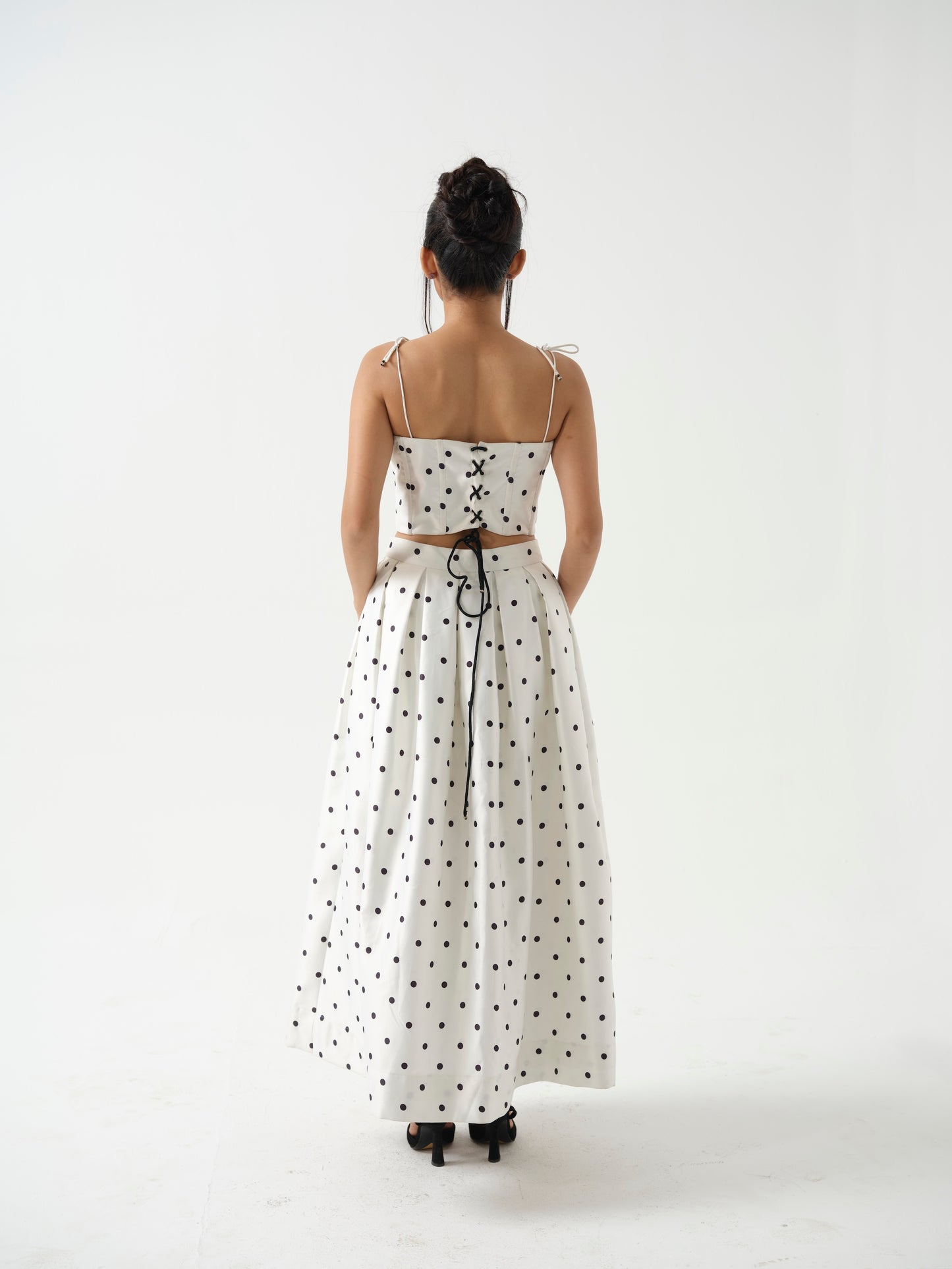 BLOOMIE- corset top paired it with tea length skirt.