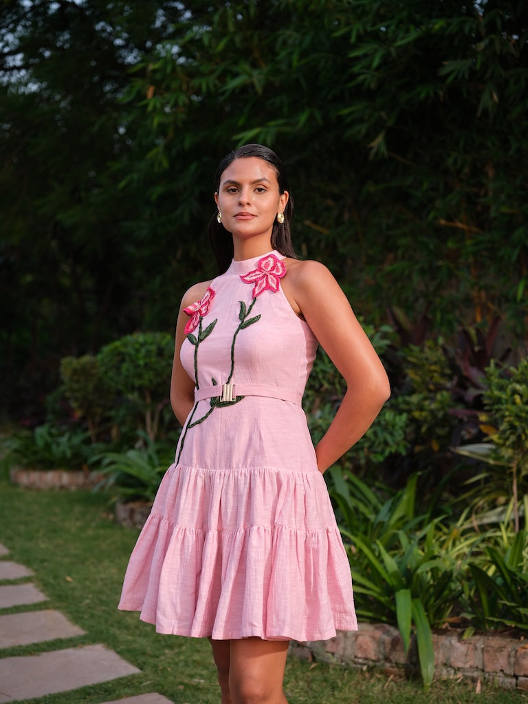 ESTELLE - A pink deep-cut dress with a two-tier gathered flare