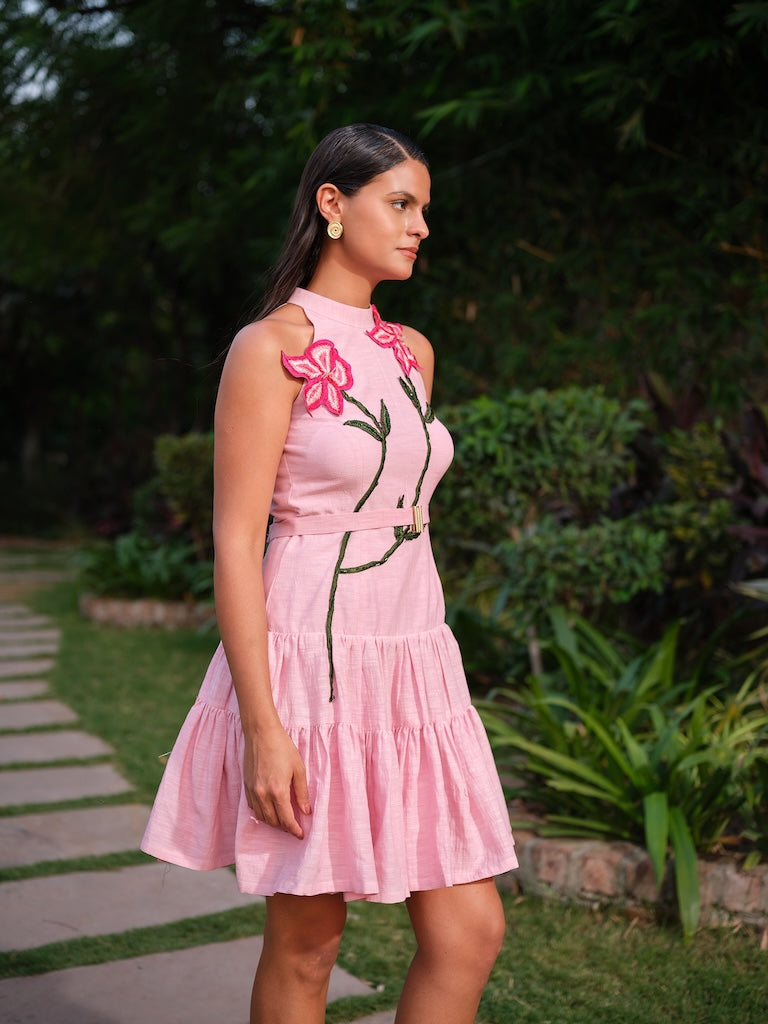 ESTELLE - A pink deep-cut dress with a two-tier gathered flare